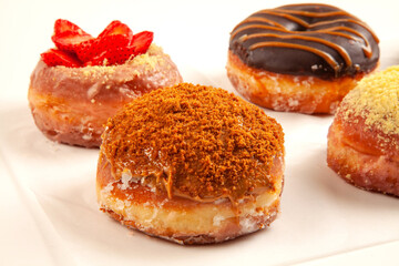 Brioche doughnuts group shot with lotus biscuits on the side and cream filling