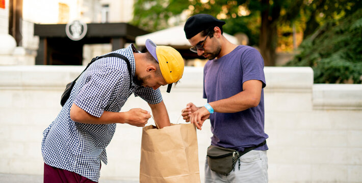 recieving the food bag delivery from the courier, package delivering service