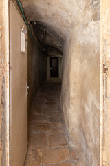 Fototapeta na wymiar Tunnel entrance under the building to a private house in Christian quarters in the old city of Jerusalem, Israel
