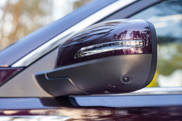 road safety. 360 terrain system option in a modern car. close-up side view rearview mirror of...