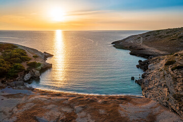 beautiful sunrise on a clean sandy beach on a mediterranean island