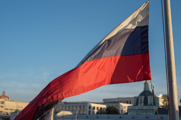 Fototapeta na wymiar The flag of the Russian Federation waving in the wind