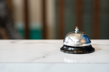 Hotel ring bell on counter desk at front reception 