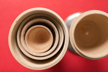 wooden objects on red