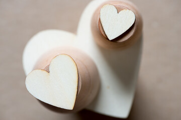 plain hearts on wooden objects - shallow depth of field