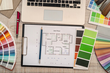 Fototapeta na wymiar architectural plan with color sample palette, designer working