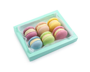 Many delicious colorful macarons in box on white background