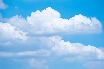 Big white clouds in summer with blue sky background.