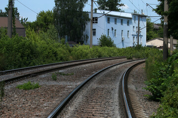 The railway, bushes and building