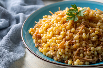 Traditional delicious Turkish food; Couscous pilaf with vermicelli (Turkish name; Sehriyeli kuskus pilavi)