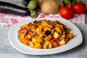 Turkish Kebab eggplant, potatoes, pepper and piece of meat. Vegetables kebab. Turkish cuisine tops view - Turkish name; Sebzeli Koz Kebab or sebze kebabi