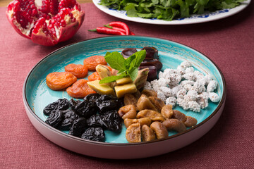 Set of different dried fruits and berries served in a restaurant