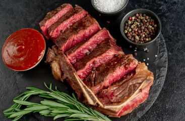 Grilled marbled beef New York steak on stone background	