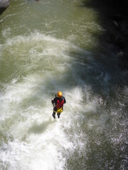 Canyoning and climbing in a gorge in the Italian Dolomites