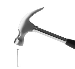 Hammer and metal nail on white background