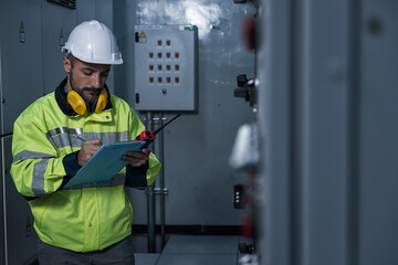 engineer working on the checking status switchgear electrical energy distribution substation