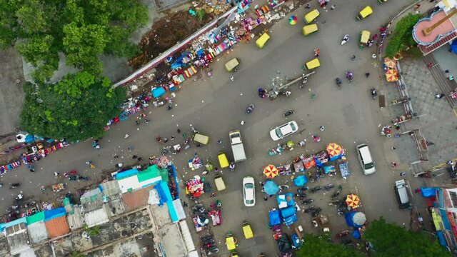 Aerial pull away of busy intersection in Bangalore India