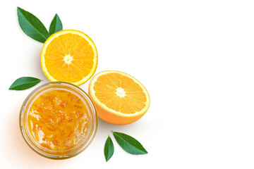 Orange jam in glass jar on white. Top view.