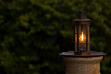 A oil lantern background with orange flame and copy space
