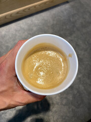 Freddo Espresso Take Away Coffee Holding in Hand.