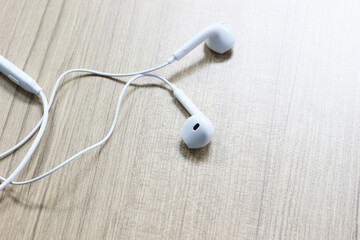 Headphones on wood background, Copy space.