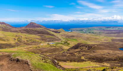 Fototapeta na wymiar A view from the summit of the Quiraing Mountains towards Staffin Bay on the Isle of Skye, Scotland on a summers day