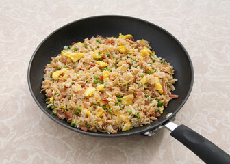 skillet pan full of colorful ham fried rice
