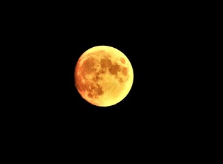 Big red moon on the dark night sky