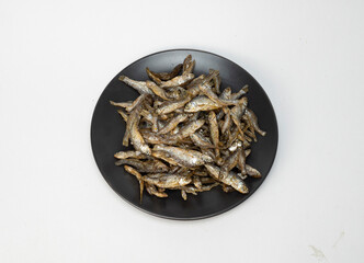 salted fish on a ceramic plate