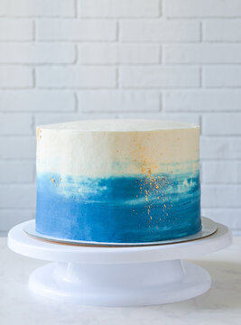 birthday cake with cream without decor. cake alignment with cream. Step 1 cake decoration. step 1 of 5