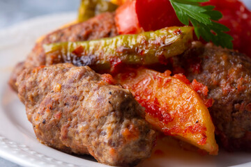 Traditional Homemade Turkish Food Kofte - Kofta with Tomato Sauce and Potatoes. (Turkish name; Izmir kofte)