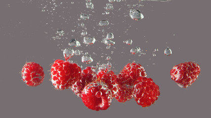 Beautiful ripe berries in water in air bubbles