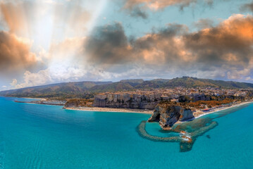 Tropea, Calabria. Aerial view of city, monastery and coastline from drone perspective.