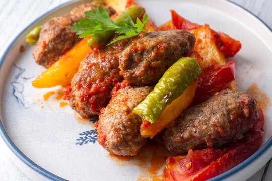 Traditional Homemade Turkish Food Kofte - Kofta with Tomato Sauce and Potatoes. (Turkish name; Izmir kofte)