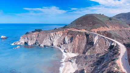 Obraz premium Bixby Bridge and Big Sur coastline on a summer sunset, California