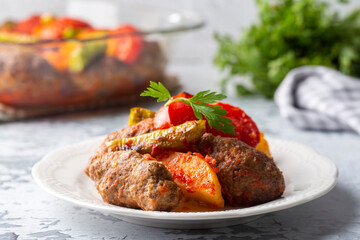 Traditional Homemade Turkish Food Kofte - Kofta with Tomato Sauce and Potatoes. (Turkish name; Izmir kofte)