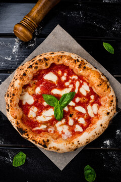 true Italian Pizza. Traditional Pizza Margherita with fresh mozzarella and basil