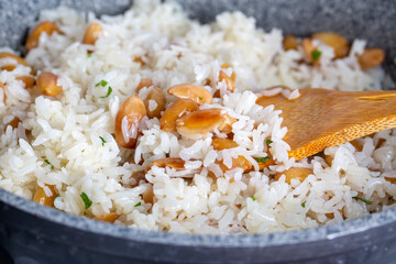 Traditional delicious Turkish food; Almond rice pilaf (Turkish name; Bademli pirinc pilavi)