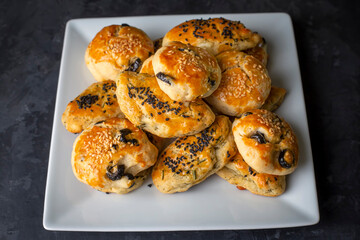 Turkish style pastry with olives and dill cheese pastry (Turkish name; Zeytinli pogaca ve dere otlu peynirli pogaca)