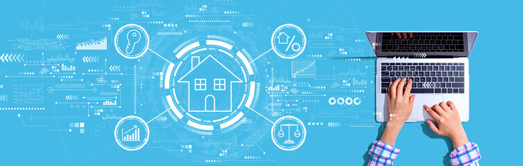 Real estate theme with person using a laptop