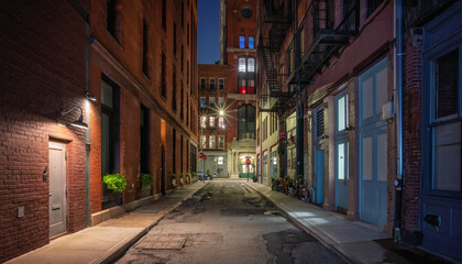 narrow street at night Manhattan New York City