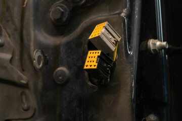 Close-up of yellow electrical connectors car plugs