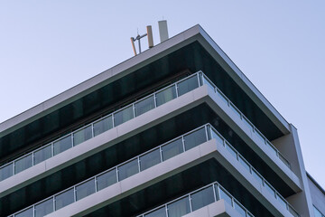 Modern building with installed antennas for mobile phones close-up