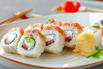 Japanese sushi roll with salmon on plate