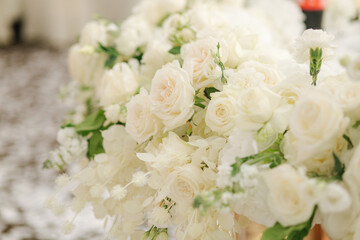 Beautiful white and green floral decoration on wedding table in restauratnt