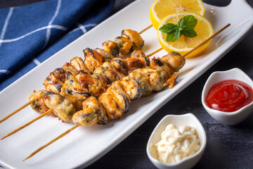 Fried mussels, delicious skewered mussels (Turkish name; midye tava, cöp sis midye)