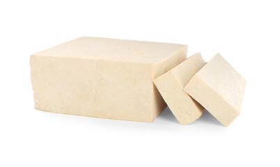 Cut raw tofu block on white background