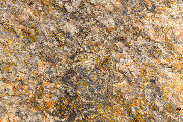 Background of granite. Texture of brown granite stone. Weathered stone surface. Copy space