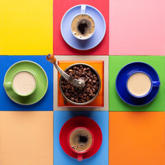 Cup of coffee and grinder at colorful abstract background texture. Coffee break time