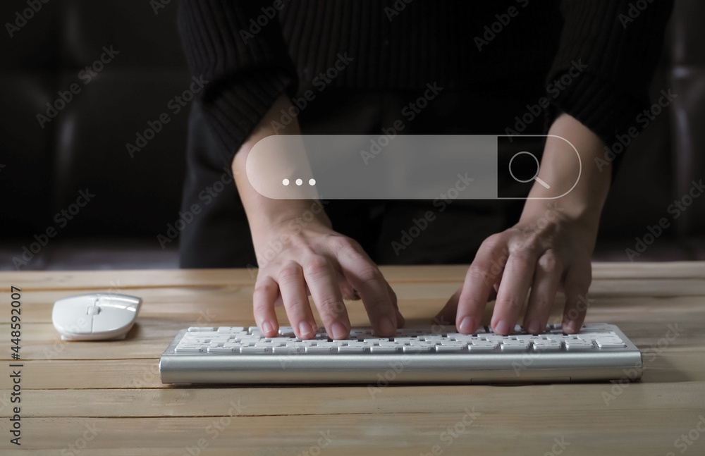 Aufkleber woman hand on keyboard notebook searching, browsing websites on internet with search bar background